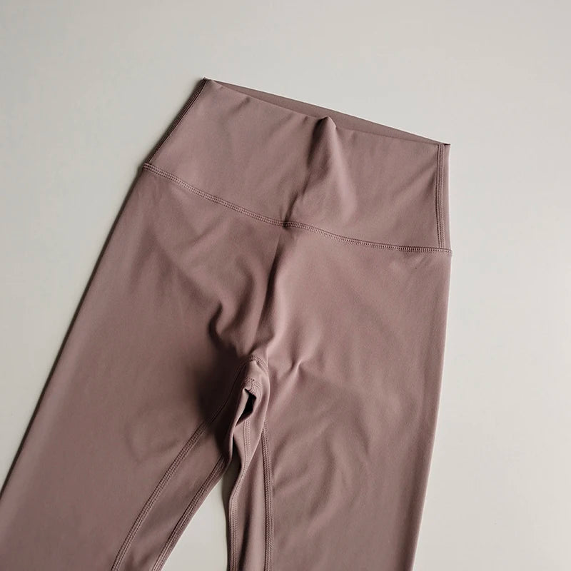 Soft mauve elastic fitness leggings for women with high-waisted design for comfort and flexibility