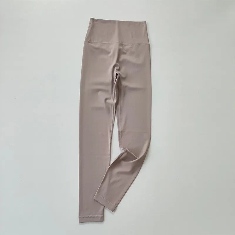 Soft beige elastic fitness leggings for women with a high waistband for comfort and support