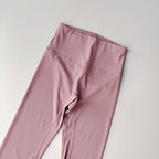 Pink elastic fitness leggings for women with a high waistband for comfort and flexibility