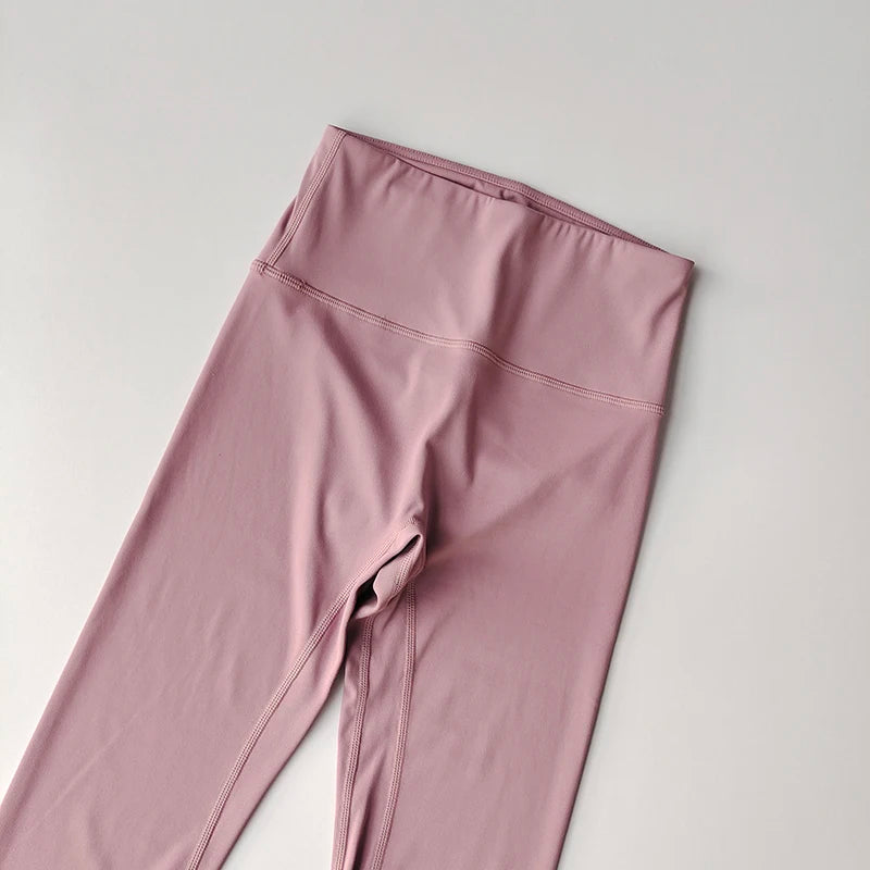 Pink elastic fitness leggings for women with a high waistband for comfort and flexibility