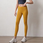 Stylish mustard elastic fitness leggings for women with a high waist design for active workouts