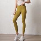Stylish elastic fitness leggings for women in mustard yellow, perfect for workouts and everyday wear