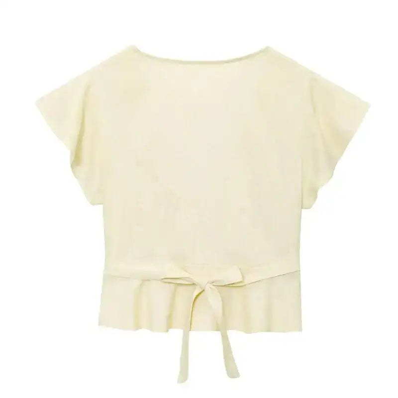 Cream short sleeve blouse and pant set top with a back tie detail from The Lady's Haven Boutique