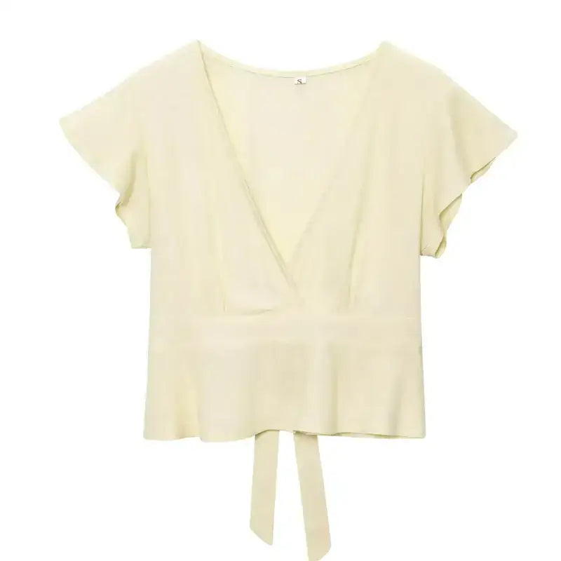 Cream short sleeve blouse and pant set top with V-neck and tie detail from The Lady's Haven Boutique