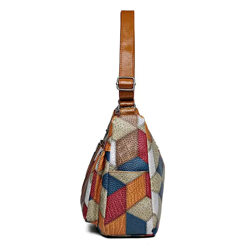 Side view of a vintage crossbody bag for women with colorful geometric patterns and a leather strap