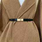 Sleek black fashion belt for dresses with a stylish gold buckle, perfect for cinching waistlines