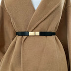 Stylish black fashion belt for dresses with a gold buckle for a chic look