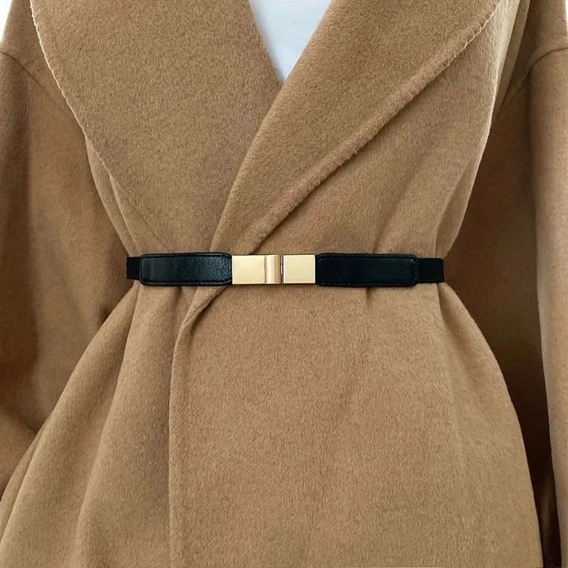Stylish black fashion belt for dresses with a gold buckle for a chic look