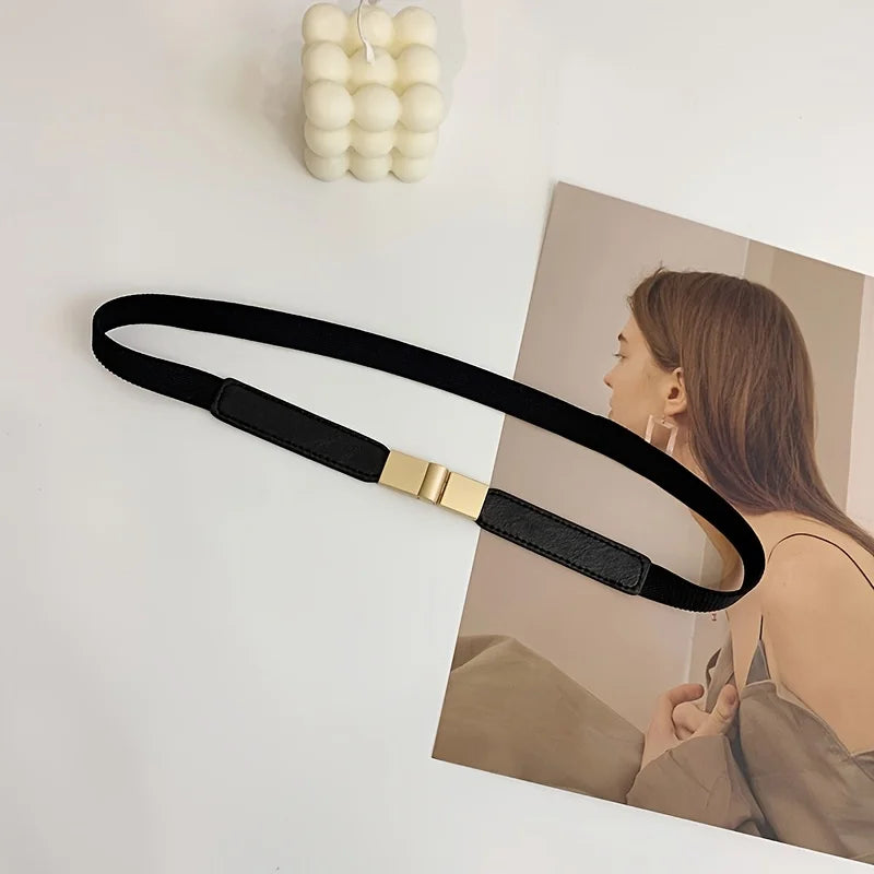 Elegant black fashion belt for dresses with a stylish gold clasp for a chic look