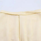 Close-up of beige fashion casual skirts with print featuring a hidden zipper closure at the waist