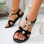 Black flat heel non slip flower decor sandals with pearl and rose embellishments from The Lady's Haven Boutique