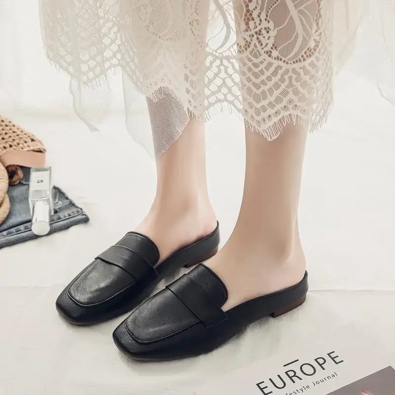 Black leather zapatos mujer casual slip-on flats with square toe design worn with lace dress