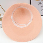 Stylish pink fashionable straw hats for women with a wide brim for sun protection