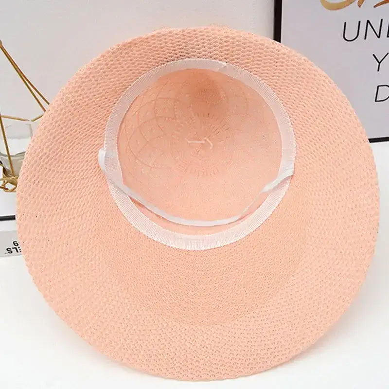 Stylish pink fashionable straw hats for women with a wide brim for sun protection