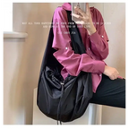 Black female casual tote purse with a stylish design, perfect for everyday use and versatility