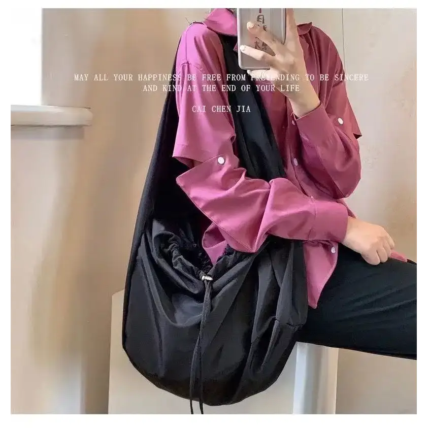 Black female casual tote purse with a stylish design, perfect for everyday use and versatility