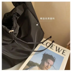 Elegant female casual tote purse made of high-quality material with adjustable drawstring closure