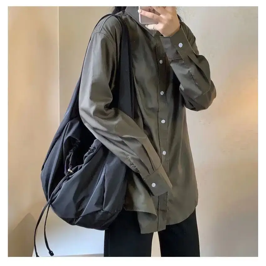 Trendy female casual tote purse shown with a model wearing a stylish button-up shirt