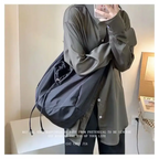 Stylish black female casual tote purse with adjustable straps for everyday use