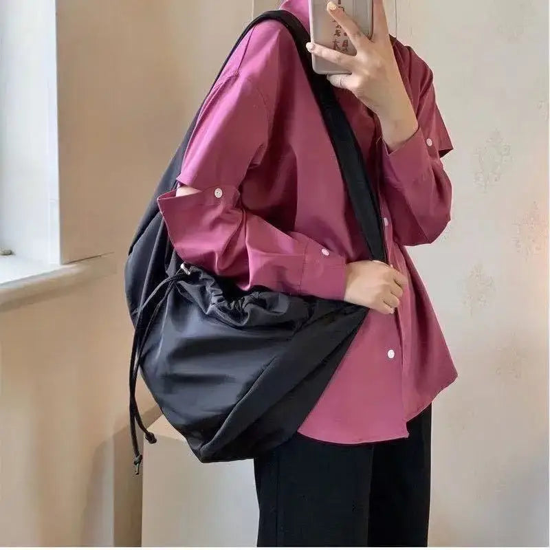 Stylish female casual tote purse in black, perfect for everyday use and versatile styling.