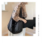 Stylish female casual tote purse in black, perfect for everyday use and versatile outfits
