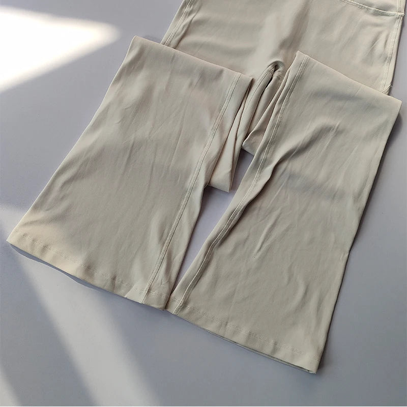 Beige female high waist yoga leggings with a comfortable and stylish fit for activewear