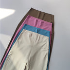 Collection of female high waist yoga leggings in beige, pink, blue, and brown colors