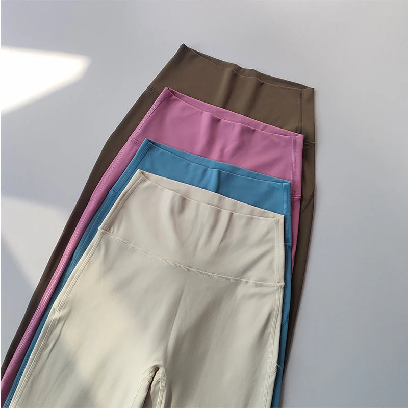 Collection of female high waist yoga leggings in beige, pink, blue, and brown colors