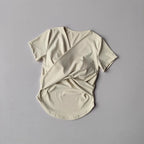 Light beige female quick dry sports top with built in cup and stylish back design
