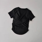 Black female quick dry sports top with built in cup featuring a stylish crisscross back design