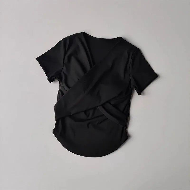 Black female quick dry sports top with built in cup featuring a stylish crisscross back design