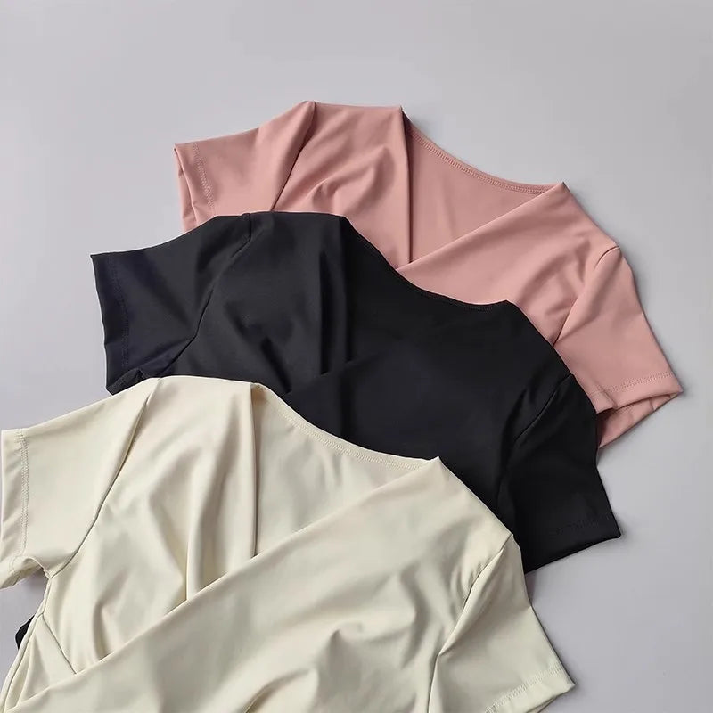 Three colors of female quick dry sports top with built in cup, perfect for active wear and yoga.