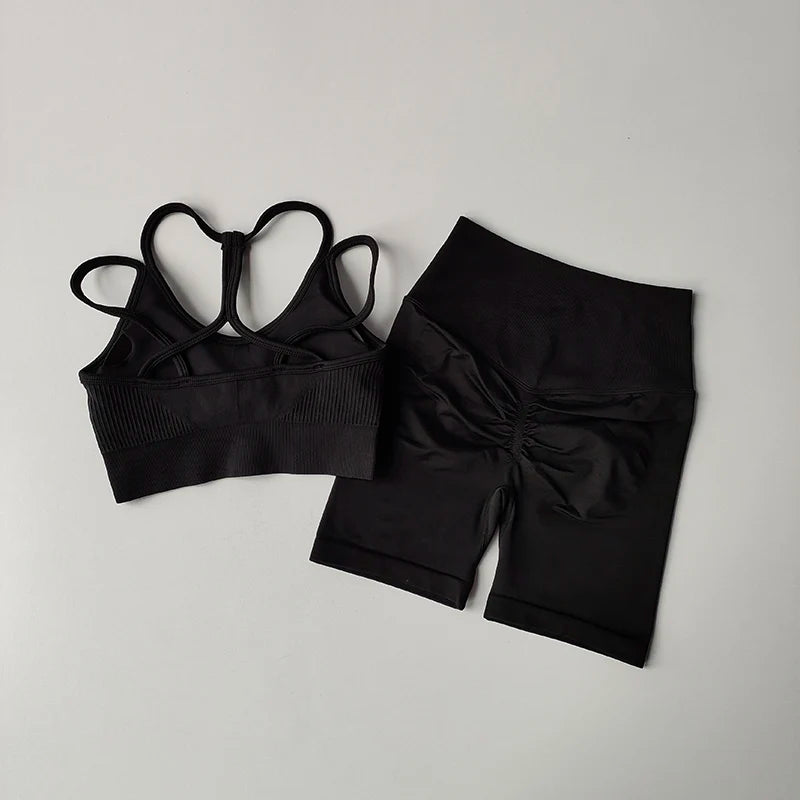 Black fitness bra and shorts set with stylish back design for activewear enthusiasts
