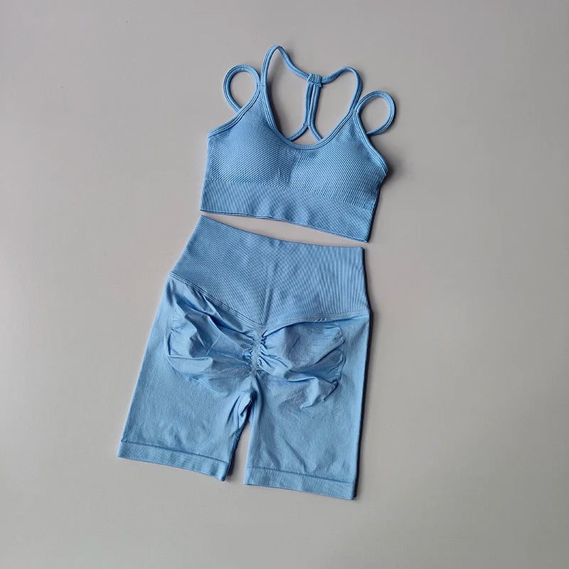 Light blue fitness bra and shorts set with a stylish design, perfect for workouts and active wear