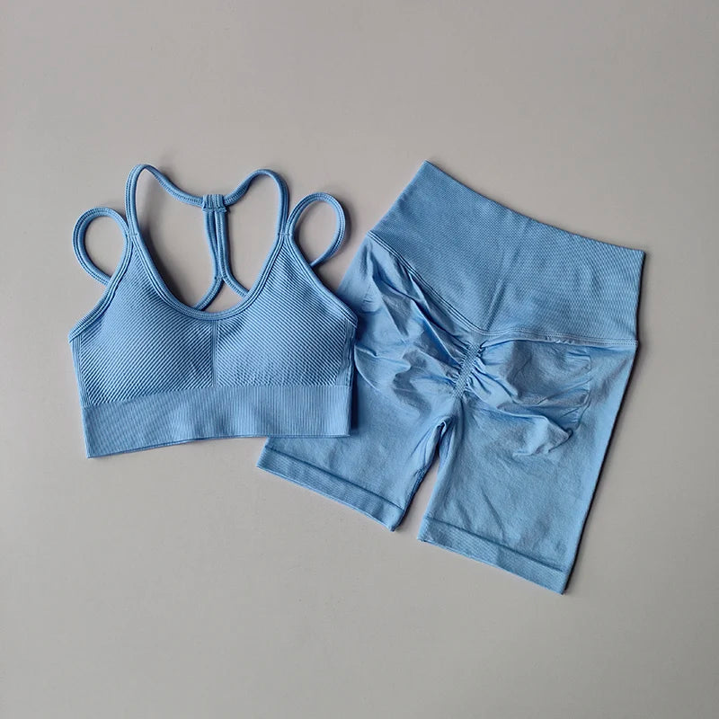 Light blue fitness bra and shorts set with stylish strappy back design for active women