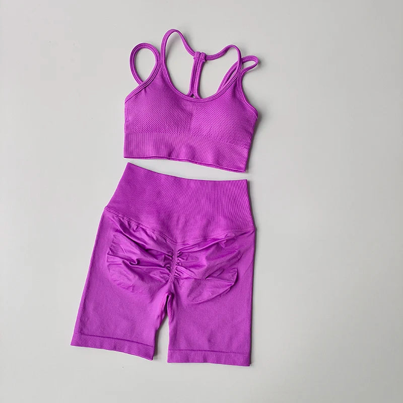Purple fitness bra and shorts set featuring a stylish design and comfortable fit for workouts