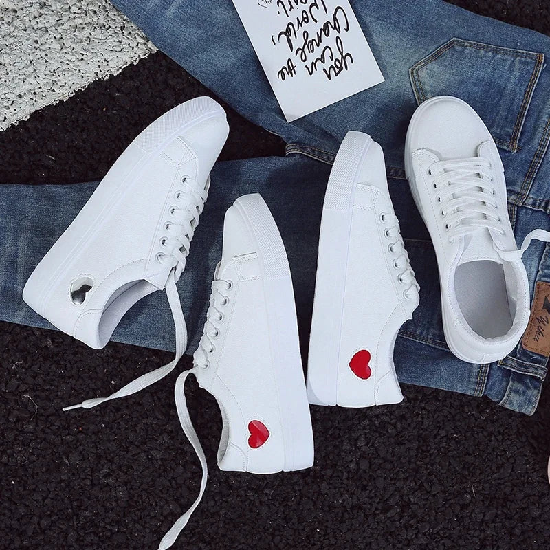 White flower design running shoes for ladies with red heart details on the side