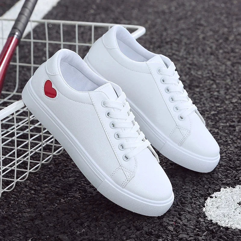 White casual sneakers with red heart detail from The Lady's Haven Boutique flower design running shoes for ladies