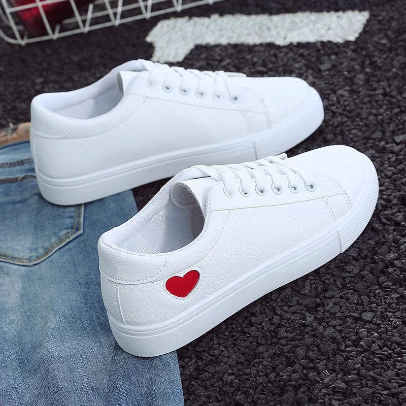 White casual sneakers with heart detail on side, flower design running shoes for ladies by The Lady's Haven Boutique
