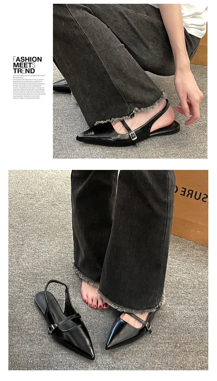 French chic diamond buckle flats in black leather with pointed toes and adjustable straps worn with casual black jeans