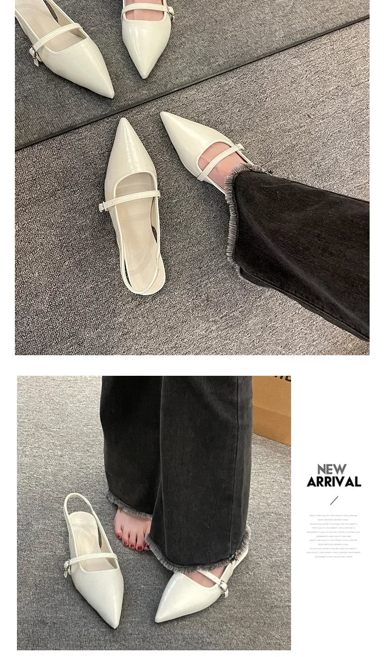 French chic diamond buckle flats in white with pointed toe and strap detail worn with black jeans