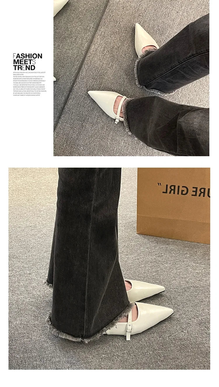 French chic diamond buckle flats in white worn with black jeans showing pointed toe and buckle detail