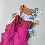 Collection of front zipper fitness bras in various colors from The Lady's Haven Boutique