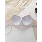 The Lady's Haven Boutique gathering bra and panty set with steel ring displayed on white surface with pearl necklace