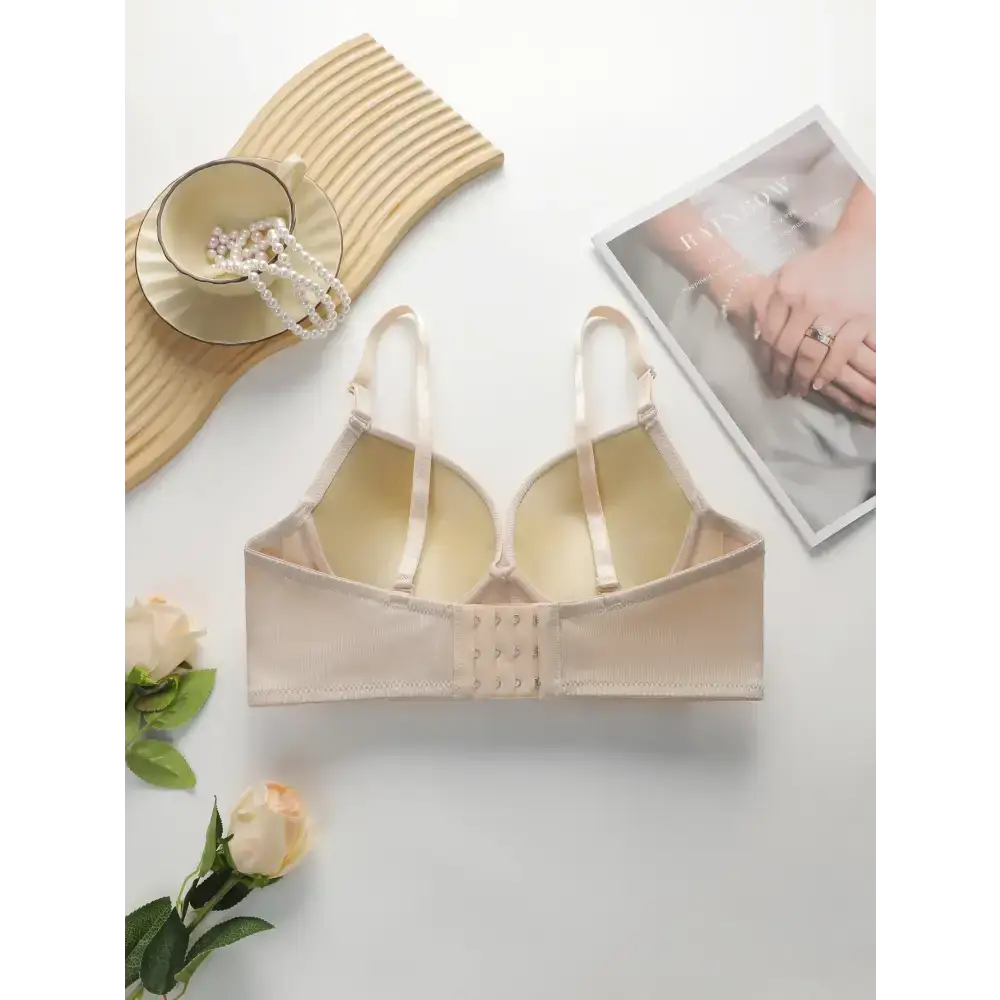 Beige gathering push up bra for ladies with adjustable straps displayed on white background