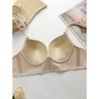 Beige gathering push up bra for ladies by The Lady's Haven Boutique on white surface with jewelry