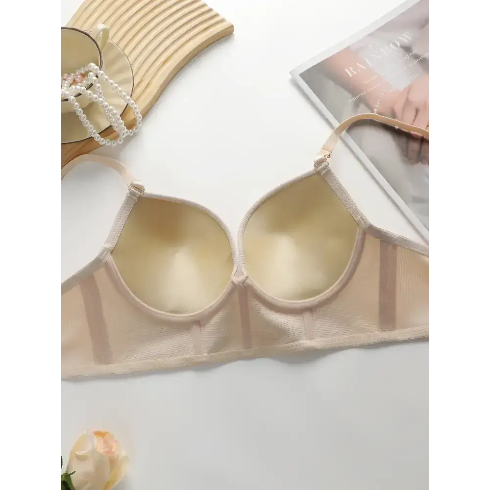 Beige gathering push up bra for ladies by The Lady's Haven Boutique on white surface with jewelry