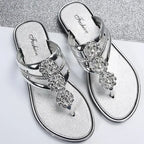 Silver flat heel glitter floral summer sandals with decorative rhinestone flowers from The Lady's Haven Boutique