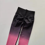 Gradient running leggings in black and pink with a comfortable high waist design for activewear