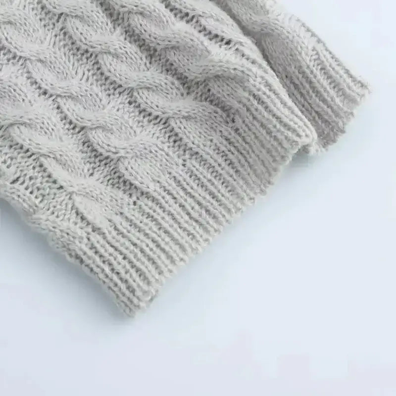 Close-up of textured knit fabric on a gray cropped sweater cardigan from The Lady's Haven Boutique